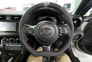 HKS Direct Fit Steering Wheel: Subaru BRZ (17-20), Toyota GR86 (22-25) & Toyota GT86 (17-20) w/ Black Smooth Leather, Perforated Grip, Oil Slick Stitching & Embroidered HKS Logo